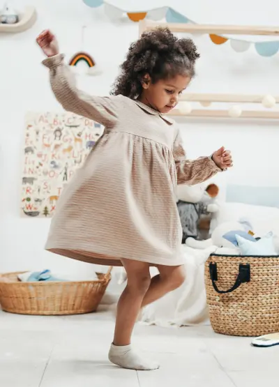 Young Girl Dancing in UltraGrip Anti-Slip Socks - Safe and Comfortable Non-Slip Socks for Active Toddlers