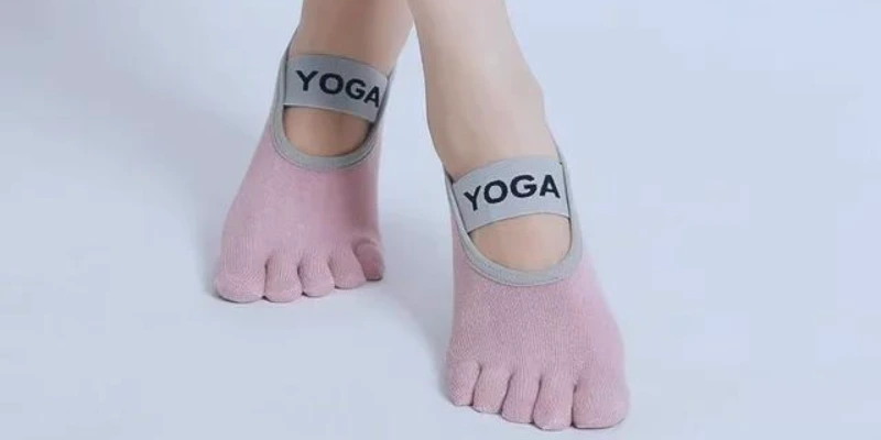 Grip socks supporting alignment and posture in pilates and barre class.